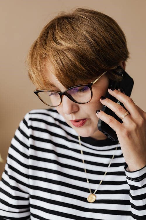 a woman speaking on the phone