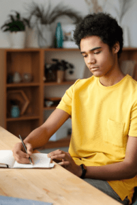 A student taking notes