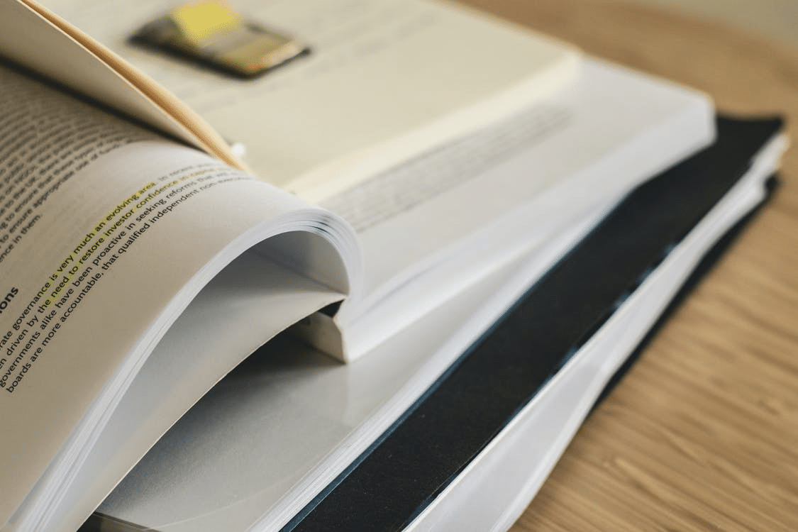 a book with highlighted text lying on a table