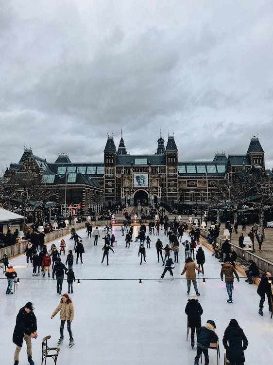 people ice skating outdoors