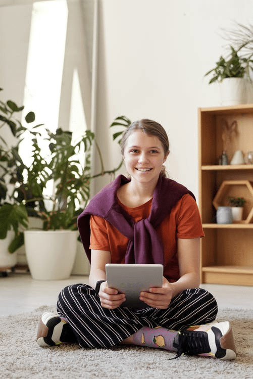a student smiling at the camera