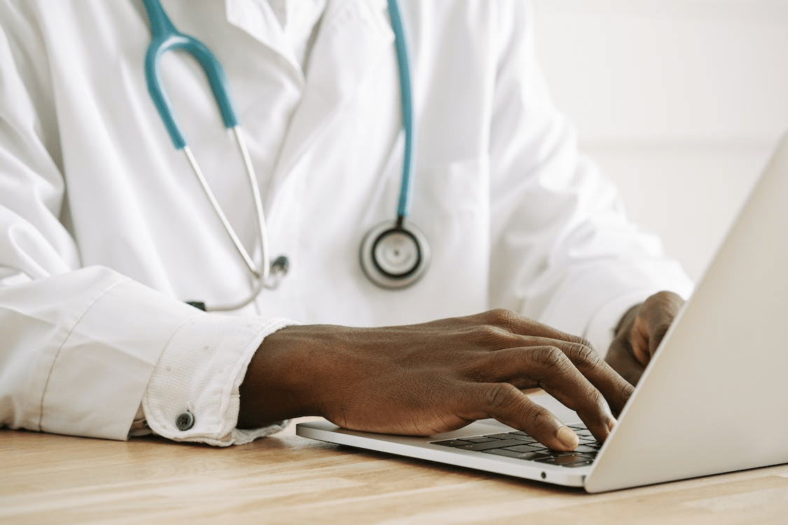 a surgeon preparing for an online lecture to A Level Biology students