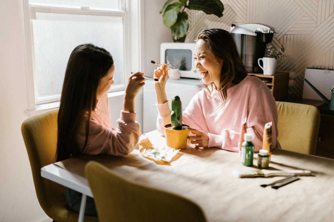 a mother enjoying an activity with her daughter