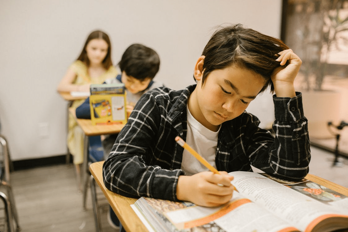 a student completing his coursework