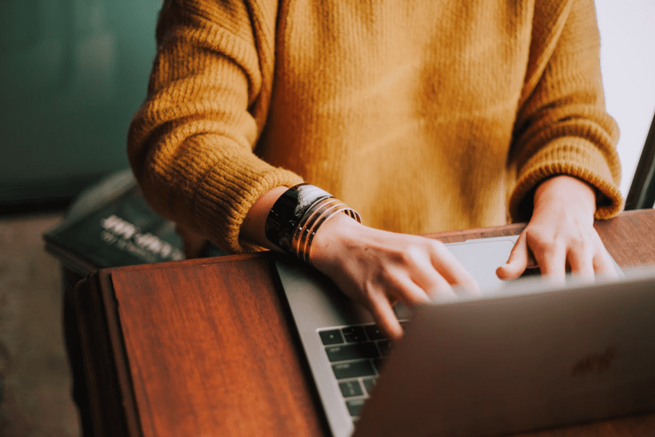 A student taking online classes on their laptop