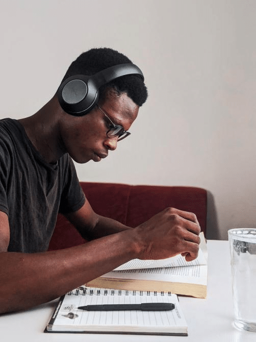 A student listening to a recorded class lecture