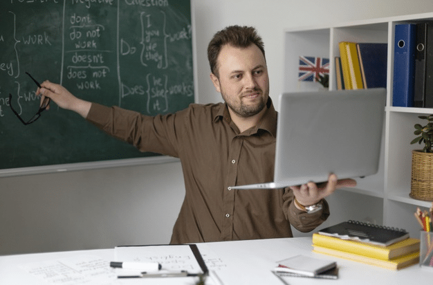 a British teacher offering an online SPAG lesson to his students