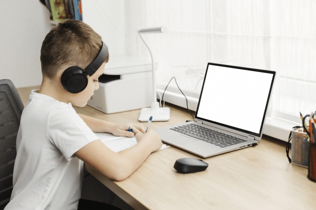 a boy attending an online class