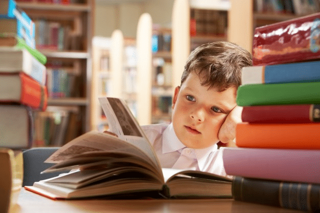 a child reading a book in a library