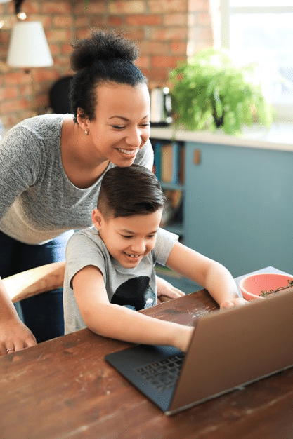 a mother checking in with her child during online school