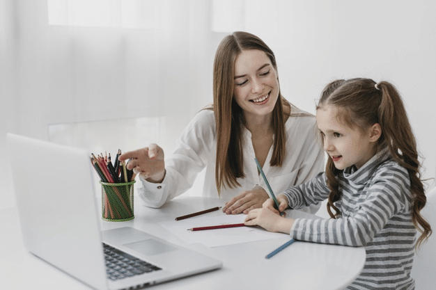 a mother helping her child with homework after class