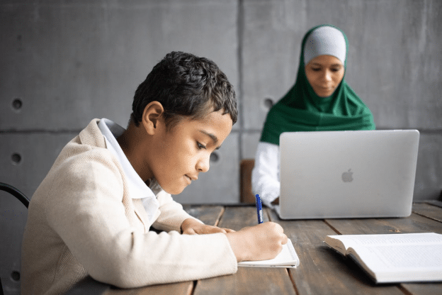 a mother preparing her son for online school