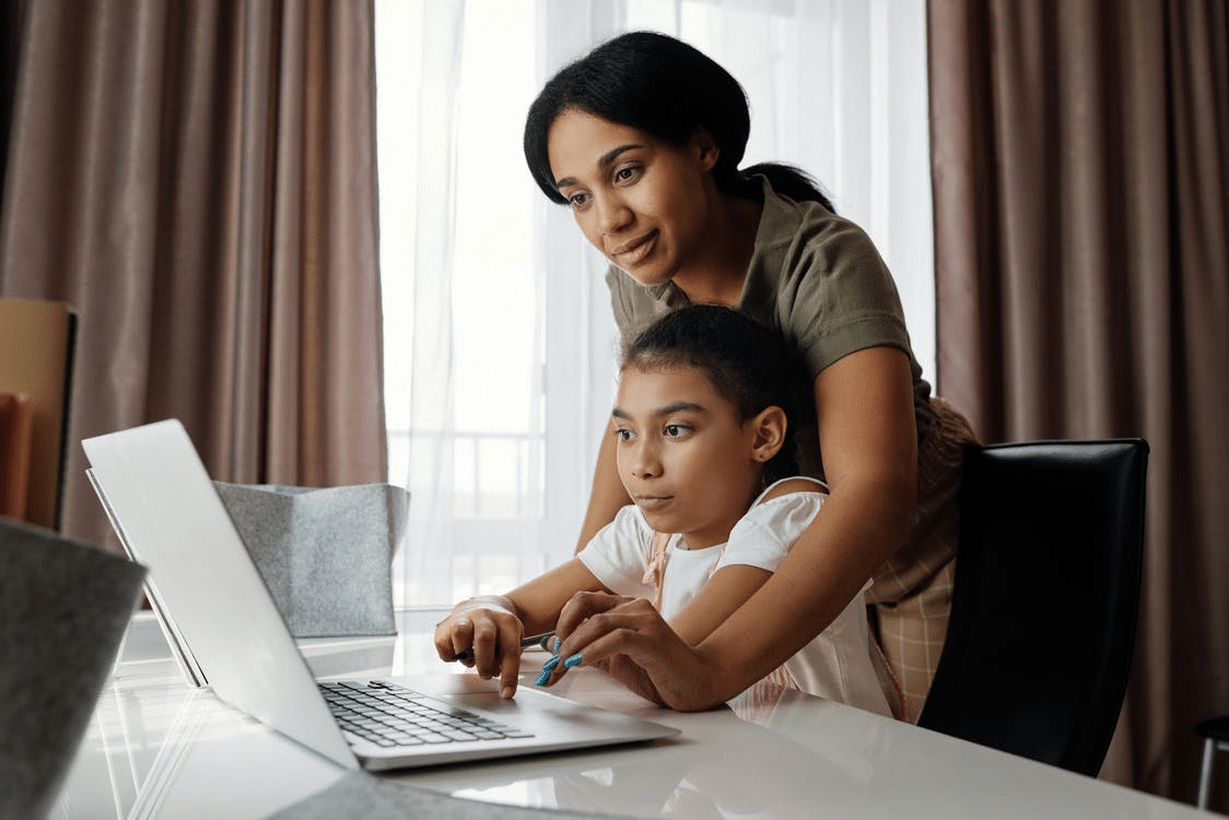 a parent analysing an online school’s curriculum with her child