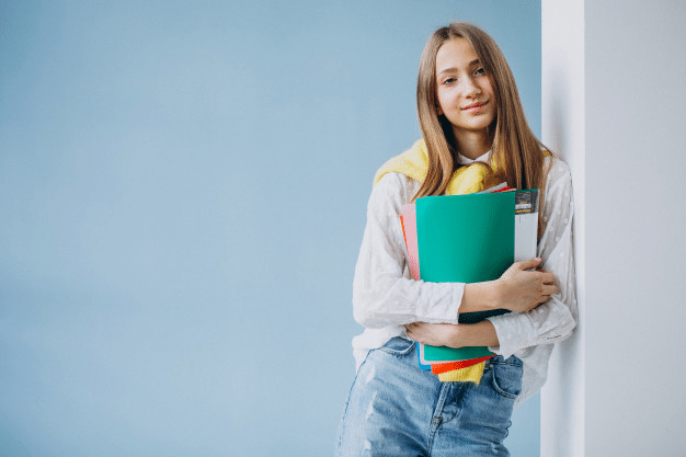 a student clutching study notes