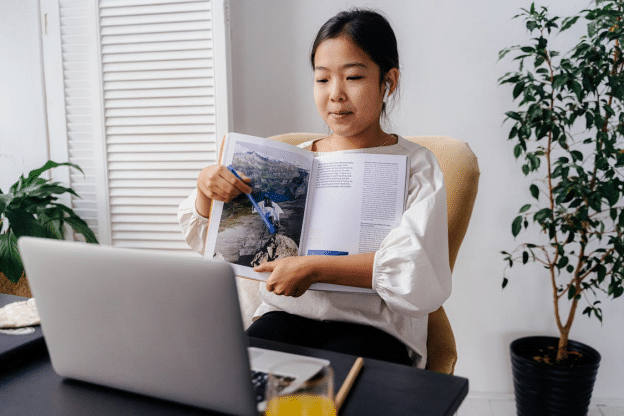 a student giving a presentation during her online class