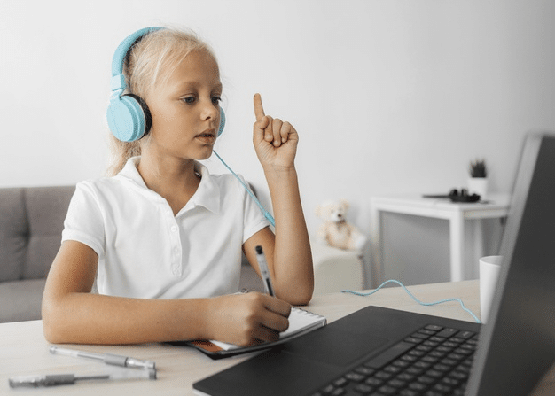 a student raising her hand to ask a question during her online class