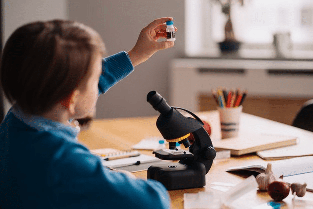 a young boy working on a fun science project