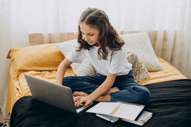 a young girl attending online primary school 1