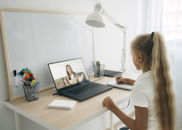 a young girl attending online primary school