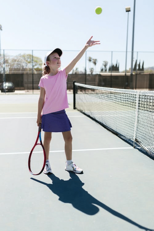 a young student playing tennis