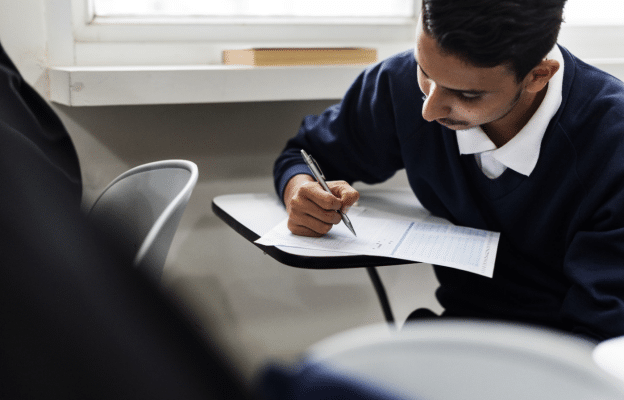 an IGCSE student sitting his Physics exam