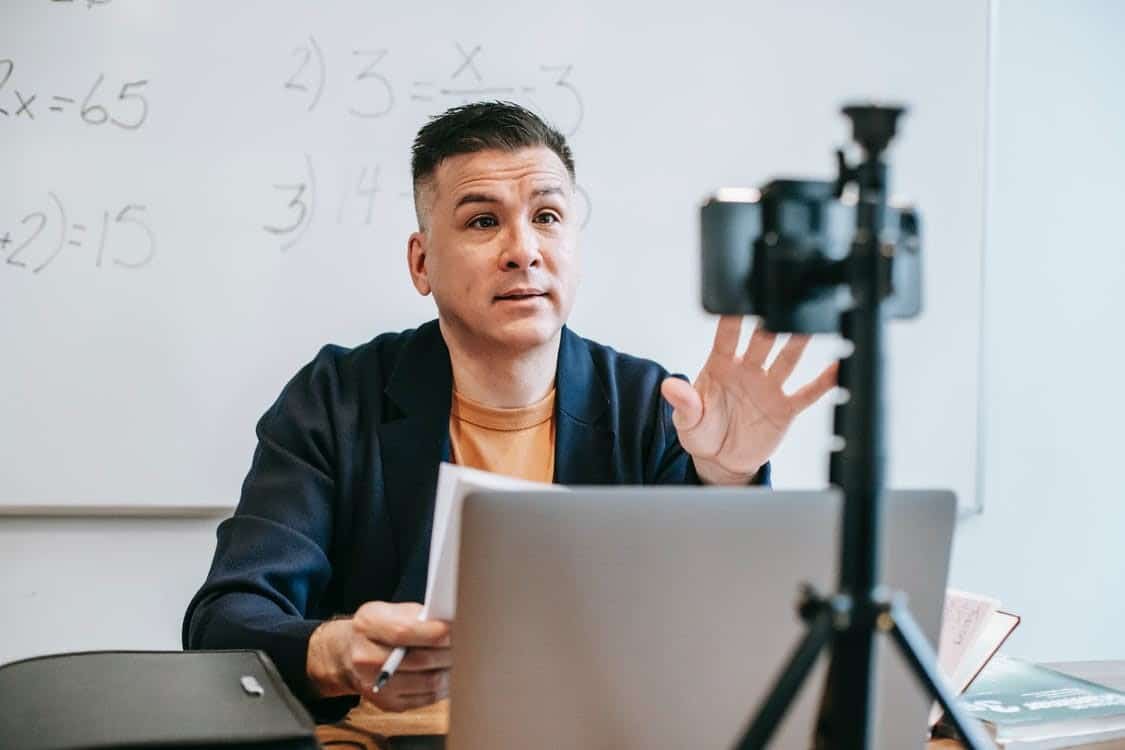 a teacher delivering an online lecture