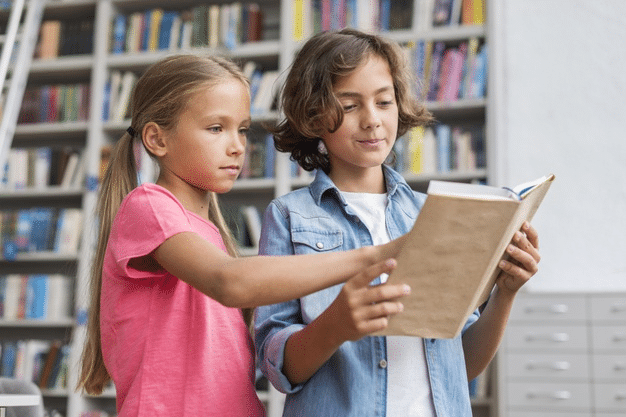 children analysing grammar rules in a SPAG book