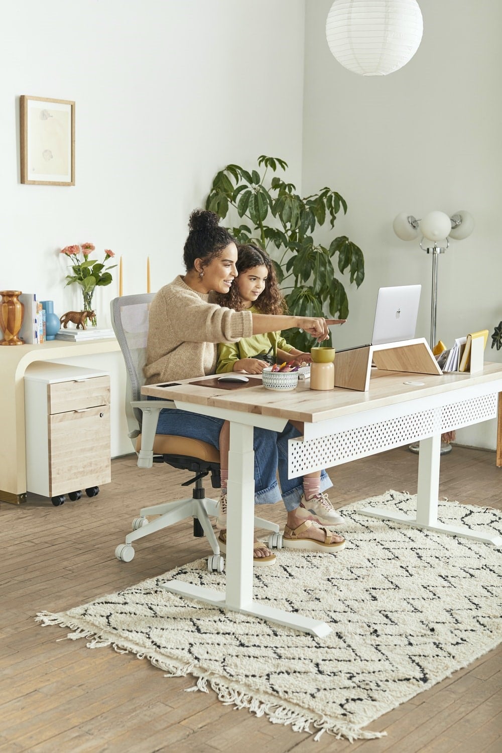 a mother preparing her daughter for online school