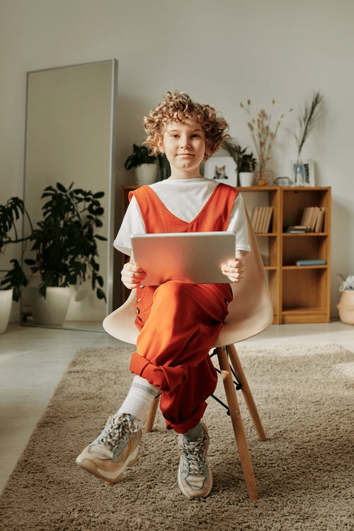 an online student holding a tablet