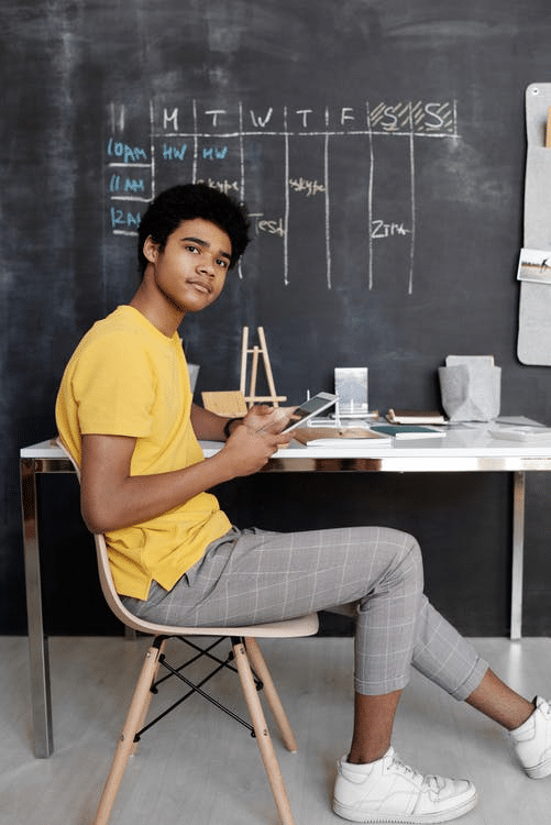 a student posing after attending his online class