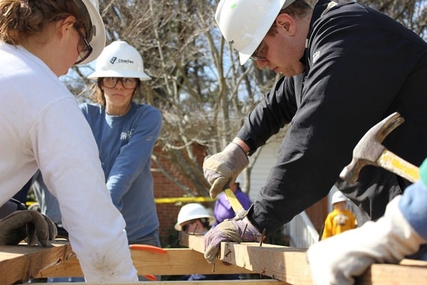 a teenage girl helping on a community construction project