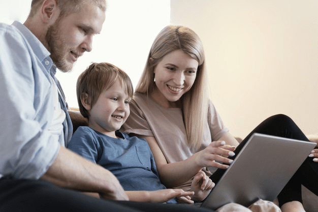 parents checking their child’s online school schedule during a weekend getaway