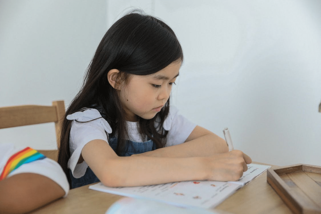 a student completing her homework in Beijing