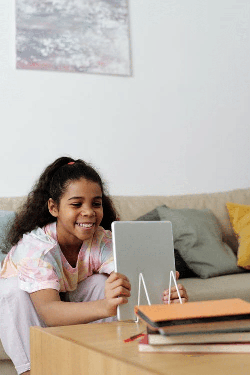  a student setting up a tablet for her online class in Durban