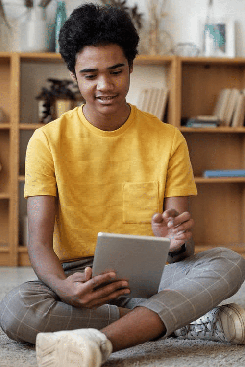 a student checking his schedule for online school in New Delhi