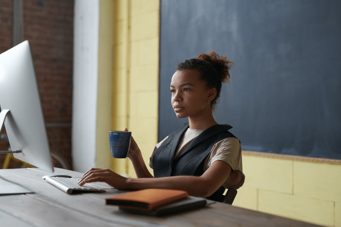 a student revising for online school in Oman