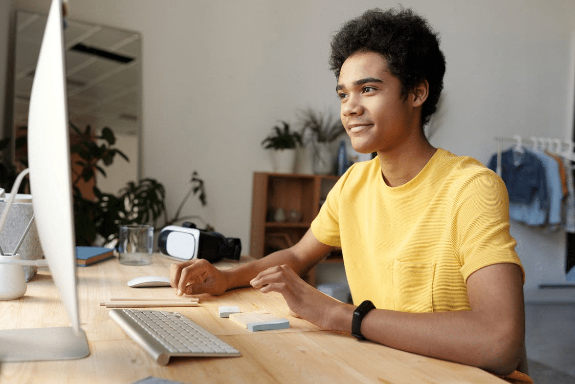 A boy studying online