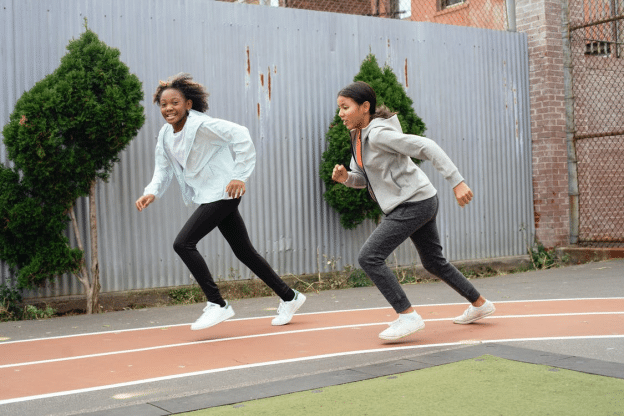 young students running on a court